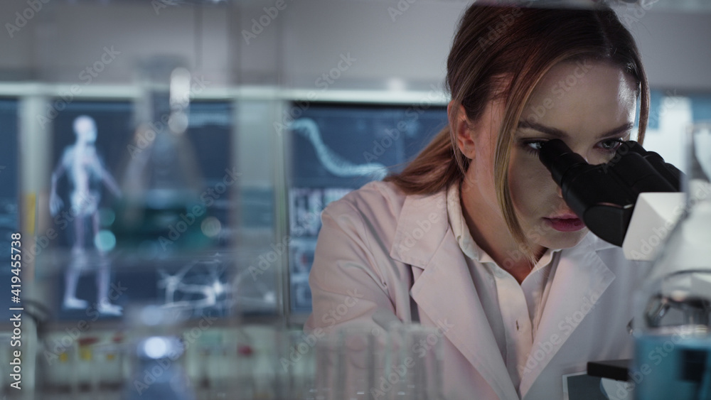 Female doctor working in laboratory. Studying human skeleton dna DNA samples Female doctor working in laboratory. Studying human skeleton dna DNA samples