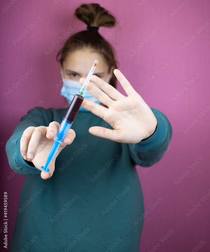 a girl with a syringe in her hand a girl with a syringe in her hand