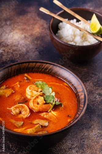 Tom Yam Kung soup. Spicy Thai soup with shrimp, coconut milk and chili pepper in bowl.