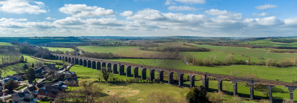 A panorama aerial view of the eastern end of the Harringworth railway viaduct, the longest masonary viaduct in the UK
