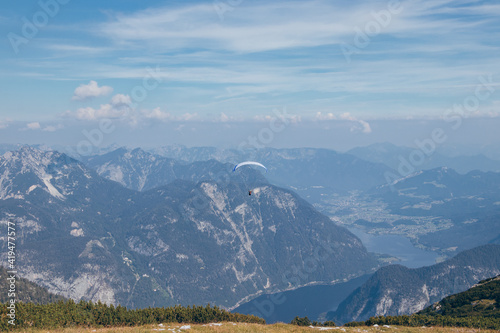 experienced man parachutes around the Austrian Alps and tries to use the right air currents to get to the right place. Dangerous sports experience. Feel the freedom