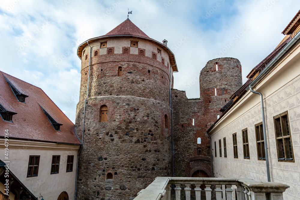 Medieval Bauska Castle courtyard with lookout tower. Castle is two castles in one - the medieval ruins of earlier castle, built for Livonian Order, and the renaissance elegance of a later palace.