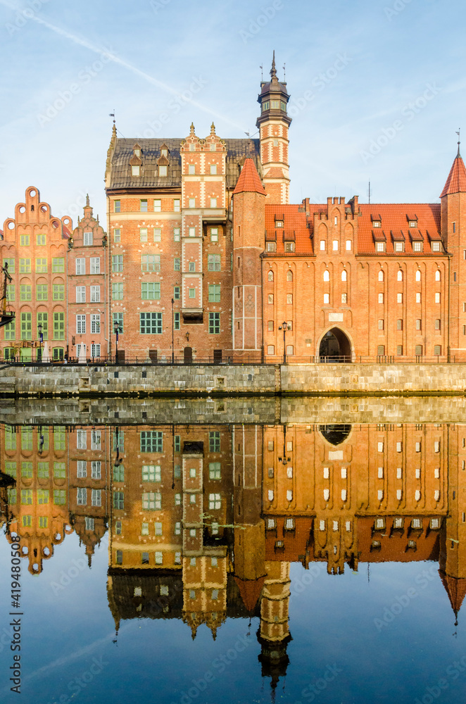Fototapeta premium St. Mary's gate, Brama Mariacka water reflection, Motlawa River Embankment, Gdansk, Poland