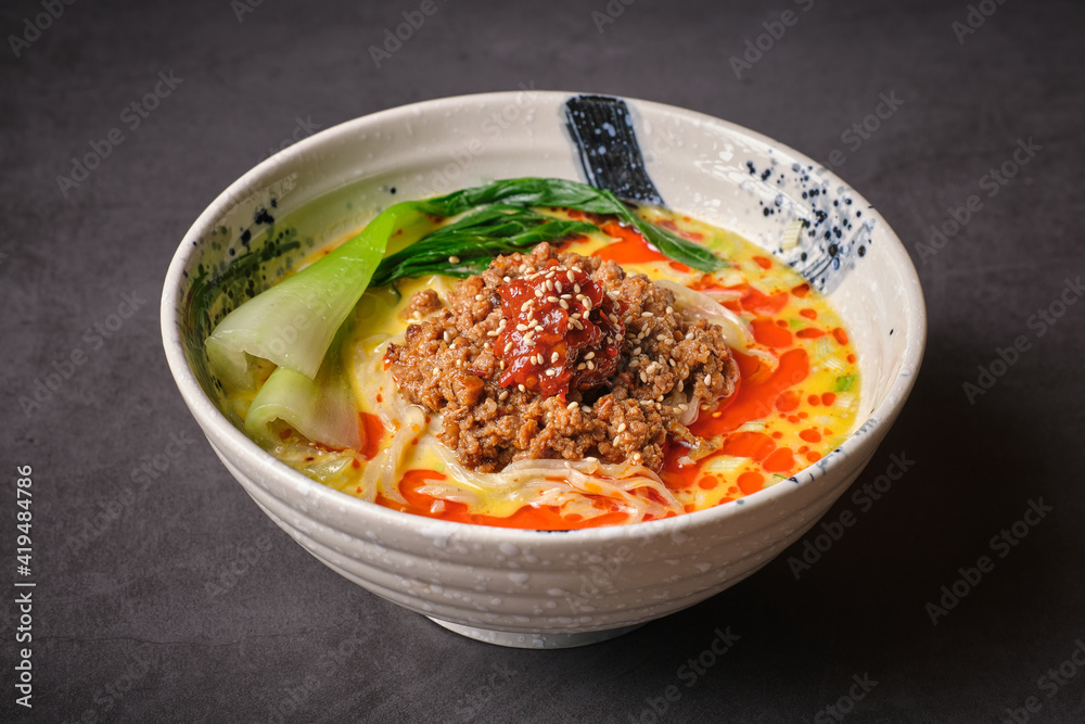Stock photo of yummy noodles soup with minced meat isolated in grey background. Stock photo of yummy noodles soup with minced meat isolated in grey background.