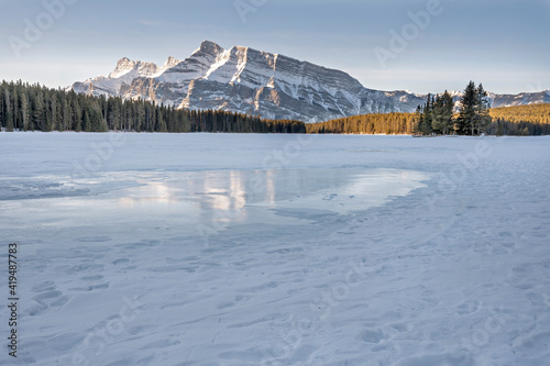 Ice reflection of Mount Rundle in Two Jack Lake in Banff National Park, Alberta, Canada