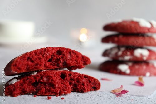 Red cookies decorated with powdered sugar

