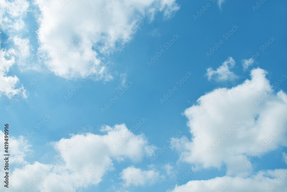Blue pastel colour sky with white clouds background.