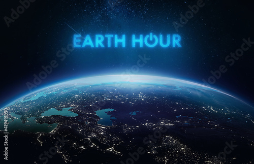 Fototapeta Naklejka Na Ścianę i Meble -  Earth Hour theme. Earth planet in outer space. Power button of electricity. Elements of this image furnished by NASA
