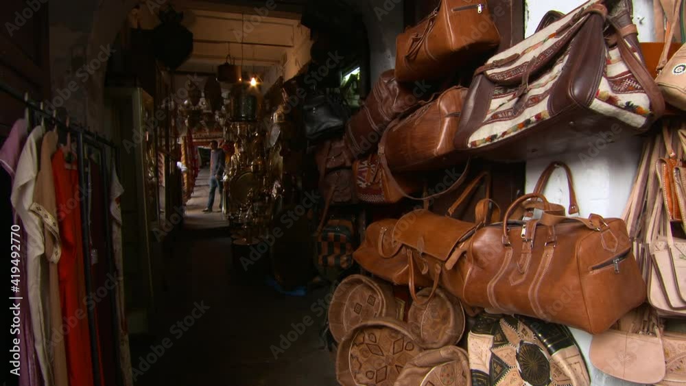 Various Wares Are Displayed In Dark Hallway In Morocco As Patrons Shop