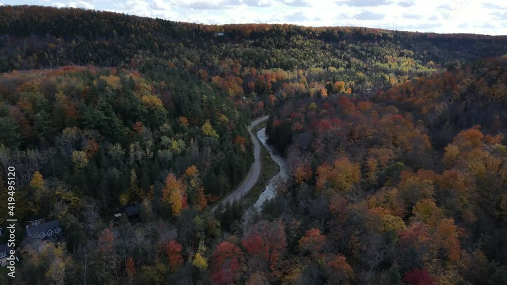Aerial over Forks of the Credit overlooking the road and hill during beuaitful fall foliage Aerial over Forks of the Credit overlooking the road and hill during beuaitful fall foliage