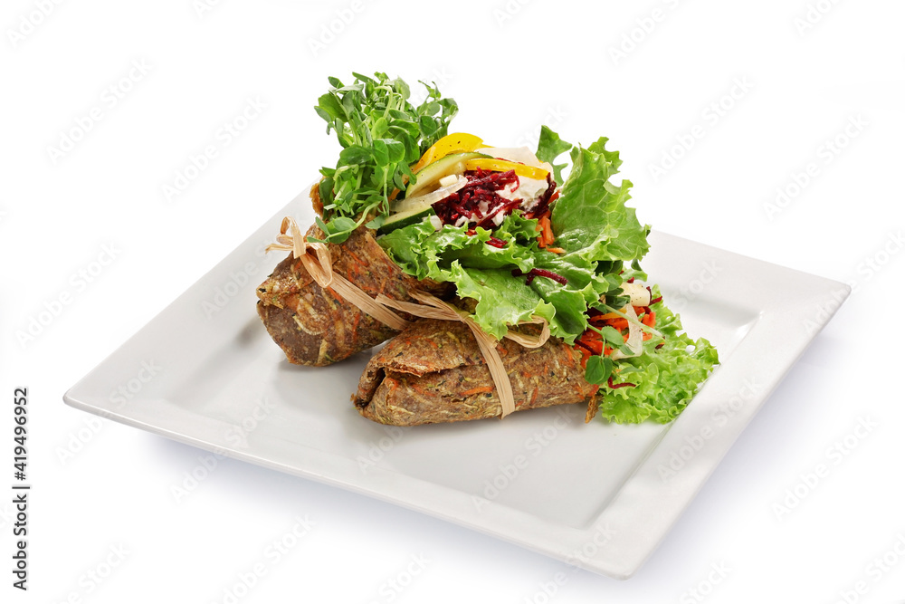Vegetarian wraps on a white plate Vegetarian wraps on a white plate