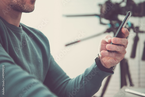 Men Using Mobile Application on His Smartphone