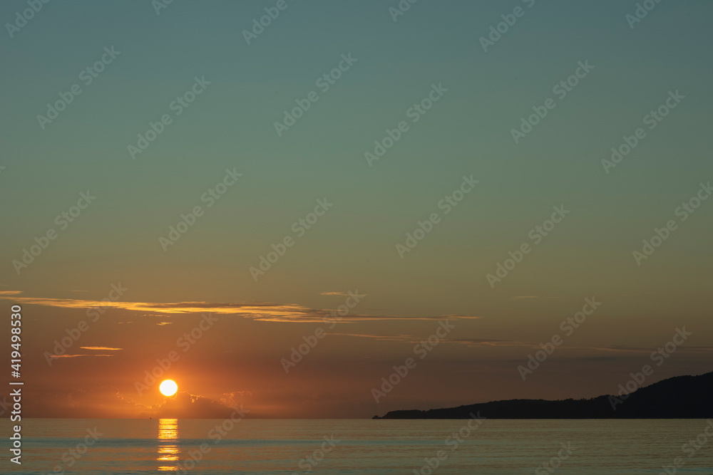 Naklejka premium sunset at the sea