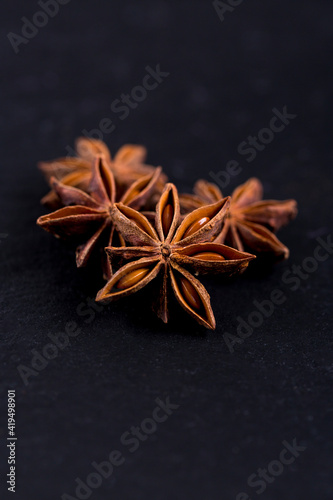 Close-up of aniseed stars on black background