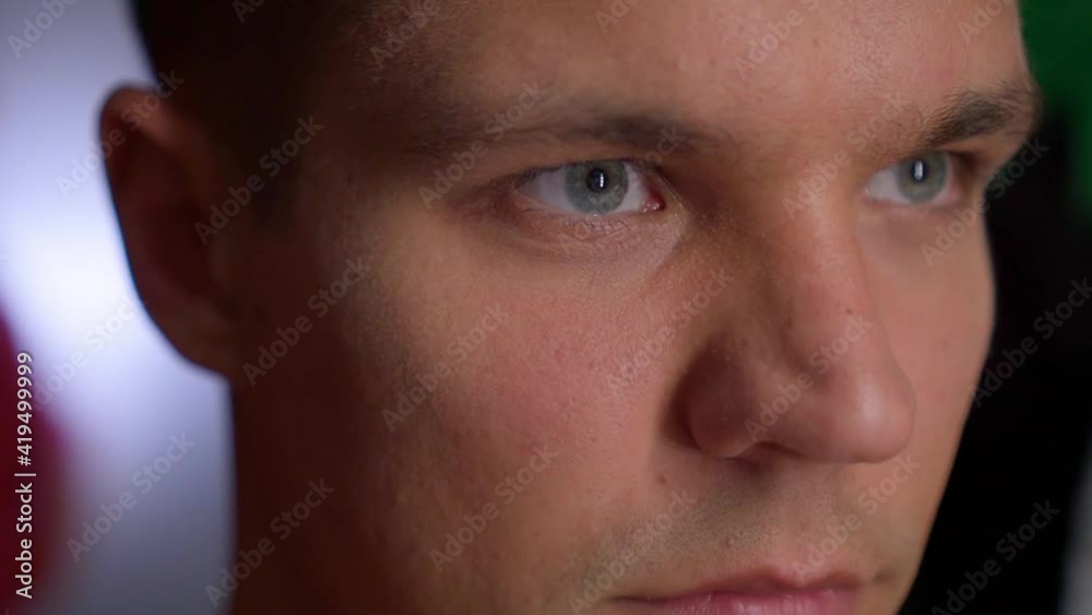 Man opens eyes in front of the mirror - pupils size decrease Man opens eyes in front of the mirror - pupils size decrease