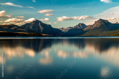 dramatic, peaceful and  serene summer  sunset photo of Lake McDonald in Glacier National Park in. Montana. photo