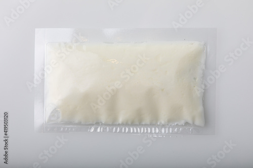 White cream in vacuum sealed plastic bag
