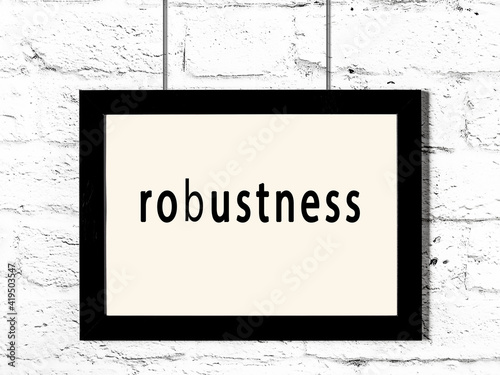 Принти на полотні Black frame hanging on white brick wall with inscription robustness