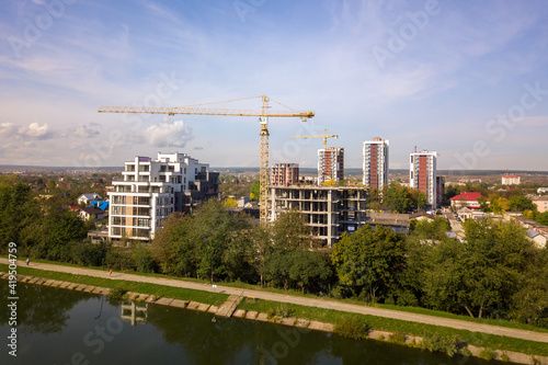 Aerial view of high residential apartment buildings under construction. Real estate development.