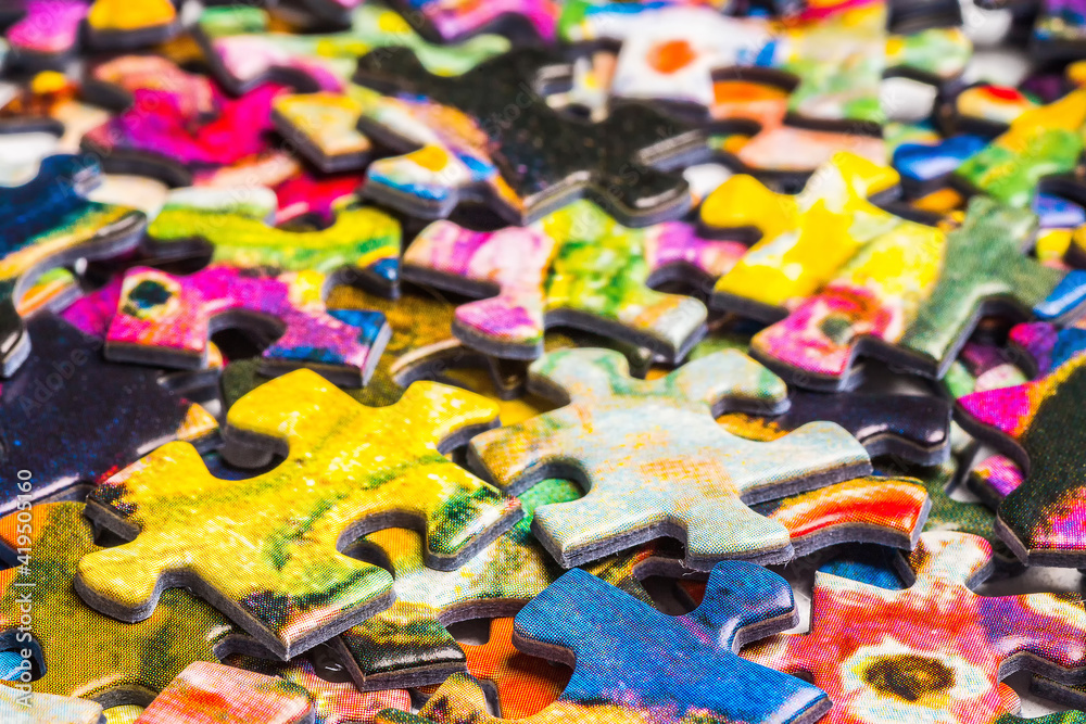 A lot of colorful scrambled puzzle pieces
