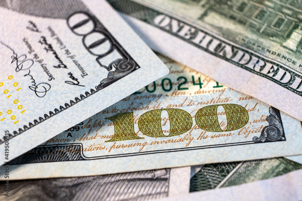 Obraz premium Close up detail of one hundred US dollars bills.