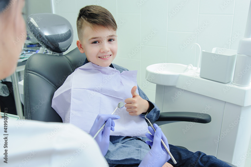 A child boy with a dentist in a dental office A child boy with a dentist in a dental office