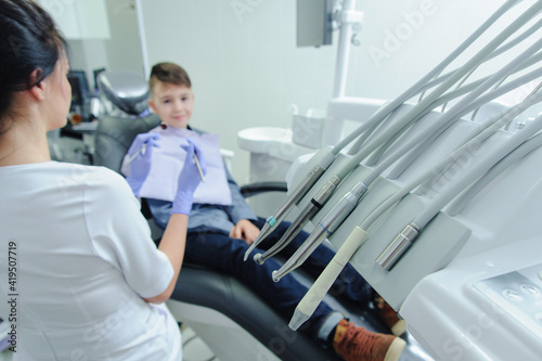 A child boy with a dentist in a dental office