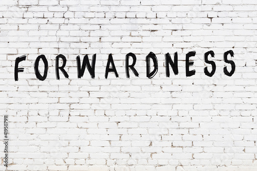 White wall with black paint inscription forwardness on it photo