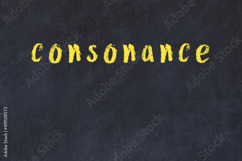 College chalk desk with the word consonance written on in