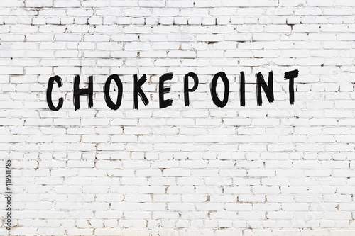 Inscription chokepoint painted on white brick wall photo