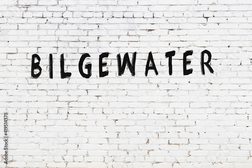 White wall with black paint inscription bilgewater on it photo