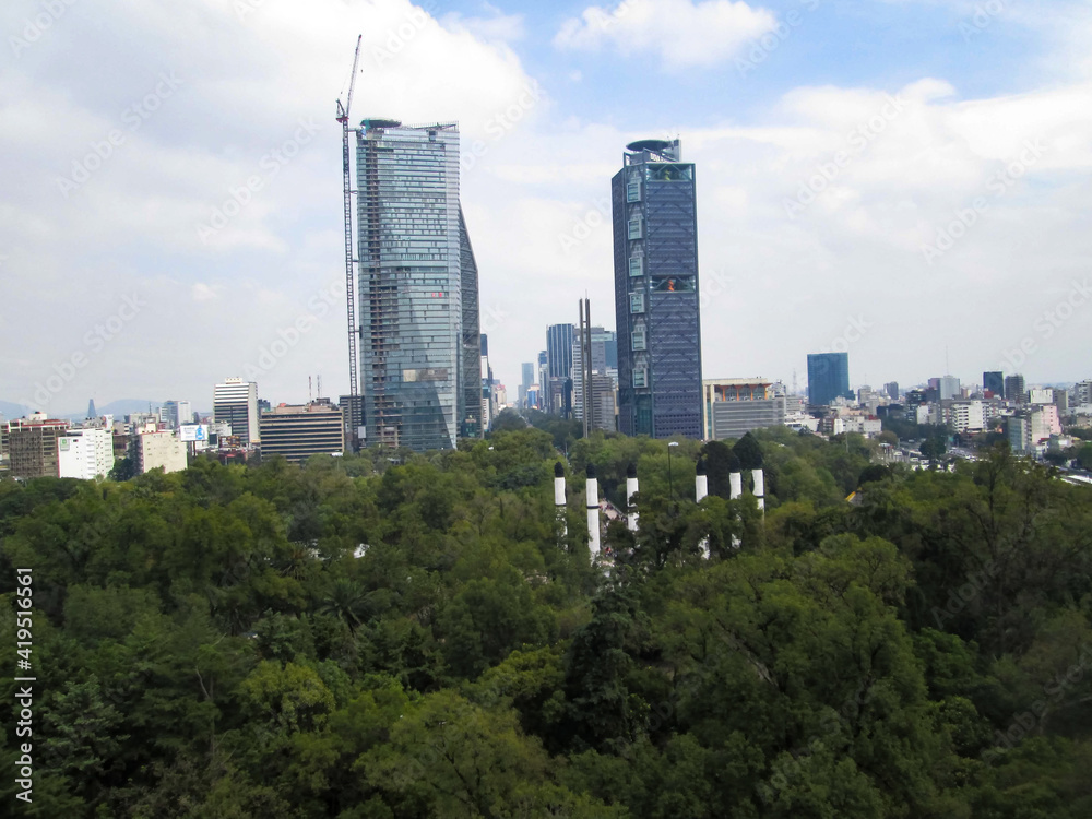 the city of buildings seen from the chapultepec forest nature and urbanism