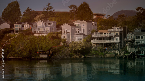 Lakeside views of homes on the water front in a small town in Northern California © Larry D Crain