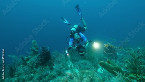 Wallpaper Mural Slow Motion: Man Scuba Diving While Photographing Coral Reef Torontodigital.ca