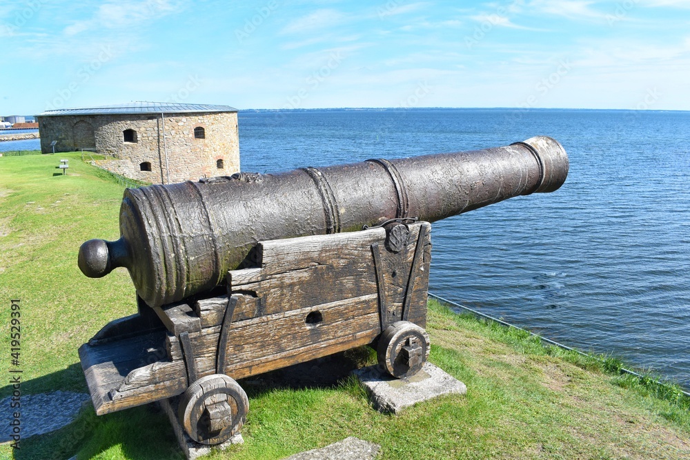 View from the wall Kalmar castle, Sweden. Ancient cannon aimed to the sea.