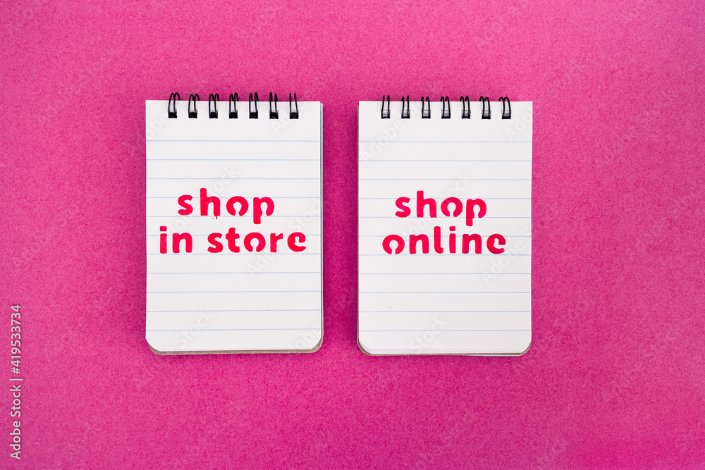 shop in store vs shop online texts on notepads, competition and retail industry shop in store vs shop online texts on notepads, competition and retail industry
