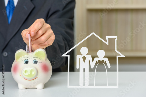 Obraz na plátně Saving money for a wedding, financial concept : Businessman bridegroom saves mon