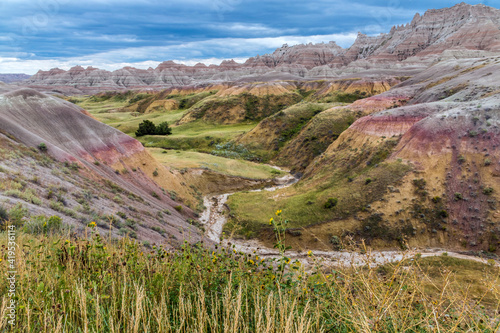 dramatic rock formations and open grasslands in Badlands national park in South Dakota. photo