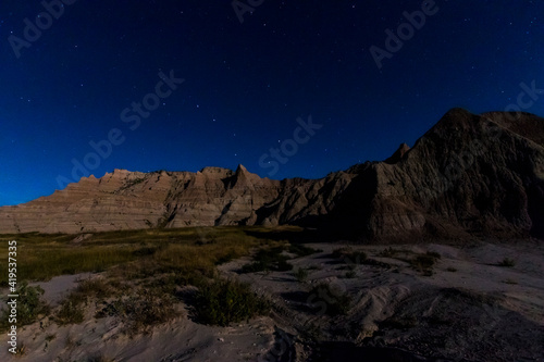 spectacular summer night sky in South Dakota s famous geologic rock formation in Badlands national Park .