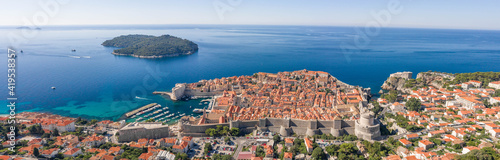 Aerial panorama drone shot of Dubrovink city old town with view of Lokrum island in Croatia summer morning