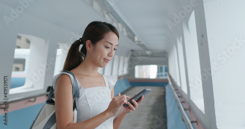 Wall Mural Woman use of smart phone in city