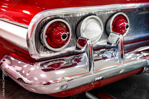 rear chrome bumper with red retro car headlights
