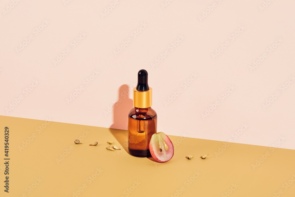 Organic cosmetics with grape seed oil. Zero Waste Winemaking. Skincare cosmetic product, diagonal isometric view and shadow Organic cosmetics with grape seed oil. Zero Waste Winemaking. Skincare cosmetic product, diagonal isometric view and shadow