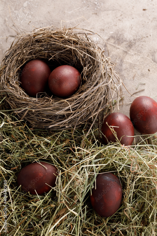 Still life many colorful easter eggs on a textural background. Rustic. Decoration from natural herbs. Easter celebration concept. Still life many colorful easter eggs on a textural background. Rustic. Decoration from natural herbs. Easter celebration concept.