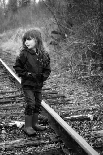 person walking on railroad