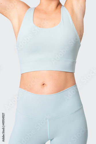 Sporty woman in blue sportswear fashion shoot