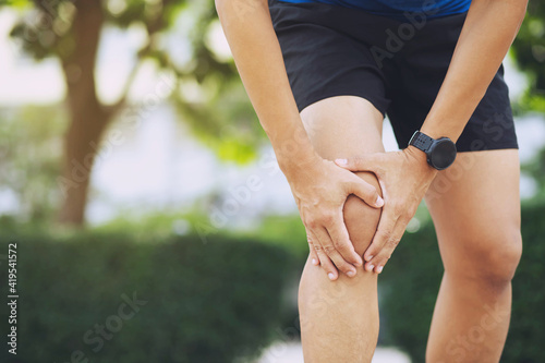 Close up athlete man  Knee pain after exercise .It happens often