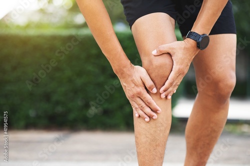 Close up athlete man, Knee pain after exercise .It happens often