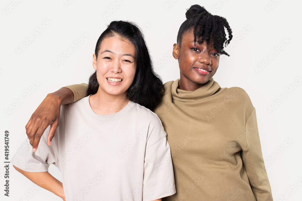 African American and Asian woman in plain t-shirts for apparel shoot African American and Asian woman in plain t-shirts for apparel shoot