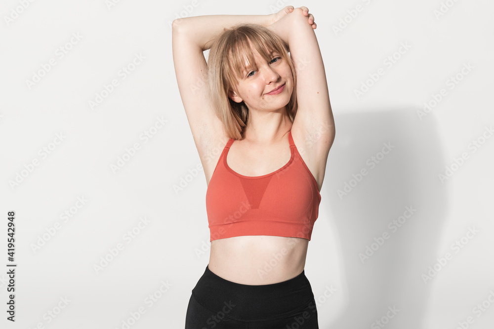 Blonde girl in red sports bra for activewear photoshoot Blonde girl in red sports bra for activewear photoshoot